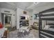 Bedroom with bunkbeds, decorative wall hangings, and an adjacent living area, perfect for a room at 5710 E Camelback Rd, Phoenix, AZ 85018