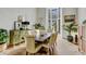 Elegant dining room with large windows, stylish furnishings, and ample natural light at 5710 E Camelback Rd, Phoenix, AZ 85018