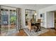 Inviting dining area with outdoor patio access, and decorative mirror at 5710 E Camelback Rd, Phoenix, AZ 85018