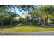 Beautiful home with well-manicured lawn, mature trees, and a charming terrace at 5710 E Camelback Rd, Phoenix, AZ 85018
