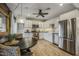 Bright kitchen featuring modern appliances and a cozy dining area with stylish lighting at 5710 E Camelback Rd, Phoenix, AZ 85018