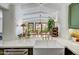 Bright kitchen with a view of the dining room and a white farmhouse sink at 5710 E Camelback Rd, Phoenix, AZ 85018
