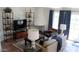 Comfortable living room with a white fireplace, modern shelving, and natural lighting at 5710 E Camelback Rd, Phoenix, AZ 85018