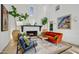 Cozy living room with fireplace, comfortable seating, and stylish decor at 5710 E Camelback Rd, Phoenix, AZ 85018