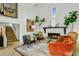 Inviting living room with a fireplace, staircase, comfortable seating, and bright ambiance at 5710 E Camelback Rd, Phoenix, AZ 85018
