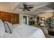 Bright main bedroom with beautiful wood accents, a ceiling fan, and neutral flooring for a seamless design at 5710 E Camelback Rd, Phoenix, AZ 85018