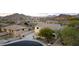 Overhead shot of a well-maintained home surrounded by beautiful desert landscape and mountains at 6206 W Buckhorn Trl, Phoenix, AZ 85083