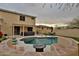 Backyard featuring a pool, spa, built-in seating, patio furniture, and a covered patio at 6206 W Buckhorn Trl, Phoenix, AZ 85083