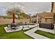 Backyard featuring a pool, hot tub, patio furniture, desert landscaping, and covered patio at 6206 W Buckhorn Trl, Phoenix, AZ 85083