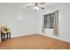 Bedroom with wood floors, a ceiling fan, a window with blinds and a teddy bear on a desk at 6206 W Buckhorn Trl, Phoenix, AZ 85083