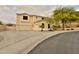 Stunning exterior view of a two-story house showcasing a lush front yard and wide driveway at 6206 W Buckhorn Trl, Phoenix, AZ 85083