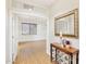 Foyer featuring wood floors, an ornate console table, and an open doorway to the next room at 6206 W Buckhorn Trl, Phoenix, AZ 85083