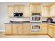 Modern kitchen with stainless steel appliances, plenty of storage and granite counters at 6206 W Buckhorn Trl, Phoenix, AZ 85083