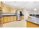 Modern kitchen with stainless steel appliances, granite counters and wood-look flooring at 6206 W Buckhorn Trl, Phoenix, AZ 85083