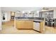 Modern kitchen featuring stainless steel appliances, light cabinets, and granite countertops at 6206 W Buckhorn Trl, Phoenix, AZ 85083