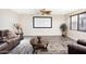 Entertainment room featuring a large screen, ceiling fan, and comfortable seating at 6206 W Buckhorn Trl, Phoenix, AZ 85083