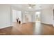 Bright, open living room featuring wood floors and recessed lighting, with neutral paint and multiple entryways at 6206 W Buckhorn Trl, Phoenix, AZ 85083