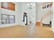 Bright living room featuring wood floors, high ceilings, a chandelier and plentiful light from the windows and front door at 6206 W Buckhorn Trl, Phoenix, AZ 85083