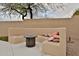 Inviting outdoor patio space featuring a built in seating area and comfortable pillows at 6206 W Buckhorn Trl, Phoenix, AZ 85083