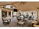Expansive outdoor space with plush seating, dining area, and TV for entertainment at 6206 W Buckhorn Trl, Phoenix, AZ 85083