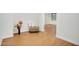 Cozy nook with wood-look floors, a decorative vase, and a cushioned ottoman at 6206 W Buckhorn Trl, Phoenix, AZ 85083