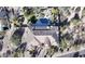 Expansive home featuring a backyard pool, waterfall feature, putting green, and a desert landscape at 6938 E Lomas Verdes Dr, Scottsdale, AZ 85266