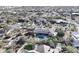 Aerial shot of backyard oasis featuring pool, turf, and outdoor seating at 6938 E Lomas Verdes Dr, Scottsdale, AZ 85266
