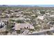Panoramic aerial view of desert home, landscaping and mountain views at 6938 E Lomas Verdes Dr, Scottsdale, AZ 85266