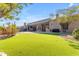 Inviting backyard with artificial turf and covered patio space at 6938 E Lomas Verdes Dr, Scottsdale, AZ 85266