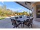 Beautiful backyard with a covered patio, an outdoor dining area, a pool and attractive landscaping at 6938 E Lomas Verdes Dr, Scottsdale, AZ 85266