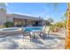 Relaxing backyard patio with desert landscaping, swimming pool, and spa at 6938 E Lomas Verdes Dr, Scottsdale, AZ 85266