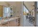Bathroom with designer granite countertop and sink with a patio view at 6938 E Lomas Verdes Dr, Scottsdale, AZ 85266