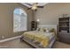 Bedroom with large window, carpet, ceiling fan and a Queen bed at 6938 E Lomas Verdes Dr, Scottsdale, AZ 85266