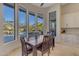 Dining area with large windows and a view of the backyard pool at 6938 E Lomas Verdes Dr, Scottsdale, AZ 85266