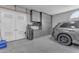 Well-organized garage with storage cabinets and car at 6938 E Lomas Verdes Dr, Scottsdale, AZ 85266