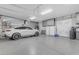 Spacious garage with a car, storage cabinets, and ample room at 6938 E Lomas Verdes Dr, Scottsdale, AZ 85266