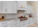 Bright kitchen with stainless steel appliances, granite countertops, and custom cabinets at 6938 E Lomas Verdes Dr, Scottsdale, AZ 85266