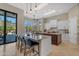 Bright kitchen featuring twin islands, breakfast bar, backyard and pool views at 6938 E Lomas Verdes Dr, Scottsdale, AZ 85266