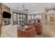 Bright and airy living room with open floor plan, fireplace, and seamless flow to the kitchen at 6938 E Lomas Verdes Dr, Scottsdale, AZ 85266