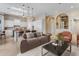 Comfortable living room with open floor plan to the kitchen, skylights, and stylish furniture at 6938 E Lomas Verdes Dr, Scottsdale, AZ 85266