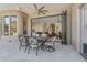 Inviting outdoor patio with dining set, opening to the interior living spaces at 6938 E Lomas Verdes Dr, Scottsdale, AZ 85266