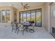 Inviting outdoor patio with dining set, opening to the interior living spaces at 6938 E Lomas Verdes Dr, Scottsdale, AZ 85266