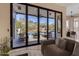 Open-air patio with outdoor seating, ceiling fan, and views of the beautifully landscaped backyard at 6938 E Lomas Verdes Dr, Scottsdale, AZ 85266