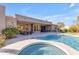 Backyard with a swimming pool, spa, and covered patio at 6938 E Lomas Verdes Dr, Scottsdale, AZ 85266