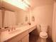 Well-lit bathroom with a tiled floor, vanity mirror and a shower with curtain at 805 N 4Th Ave # 903, Phoenix, AZ 85003