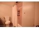 Bright bathroom featuring a shower with curtain, toilet and tiled walls at 805 N 4Th Ave # 903, Phoenix, AZ 85003