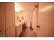 Cozy bathroom featuring a tiled floor, cabinet storage and shower with curtain at 805 N 4Th Ave # 903, Phoenix, AZ 85003