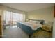 Bright bedroom with balcony, light colored carpet, and a blue bed frame at 805 N 4Th Ave # 903, Phoenix, AZ 85003
