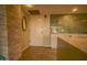 Condo entryway with stone accent wall, storage console and a tiled green accent wall at 805 N 4Th Ave # 903, Phoenix, AZ 85003