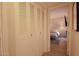 Hallway with closet providing a clear view of the bedroom with bed and lamp at 805 N 4Th Ave # 903, Phoenix, AZ 85003